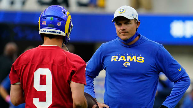 Los Angeles Rams quarterback Matthew Stafford (9) talks to offensive coordinator Kevin O'Connell during an offseason workout at SoFi Stadium.